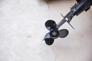 Propeller of boat on the beach photo