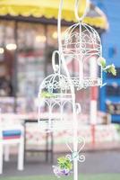 vintage wedding decorative birdcage with flowers photo