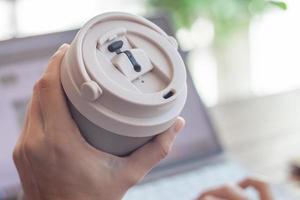 Woman hold thermos stainless steel bottle photo