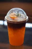 Glass of americano mixed with orange juice photo