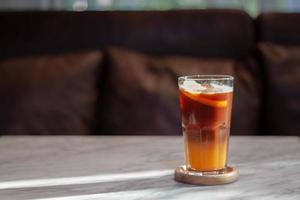 Glass of americano mixed with orange juice photo