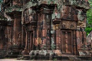 Banteay Srei is built largely of red sandstone and is a 10th-century Cambodian temple dedicated to the Hindu god Shiva, Siem Reap, Cambodia photo