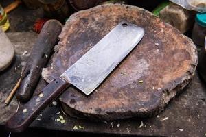 large old knife on chopping block photo