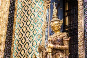 A statue of Yaksa on temple guard at the Temple of the Emerald Buddha, Bangkok, Thailand photo