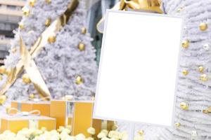 Empty board with Christmas tree, decorations and lights photo