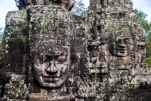 Prasat Bayon with smiling stone faces is the central temple of Angkor Thom Complex, Siem Reap, Cambodia. Ancient Khmer architecture and famous Cambodian landmark, World Heritage. photo