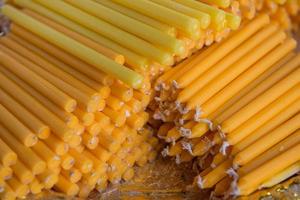 A pile of candle stick for religious ceremony photo