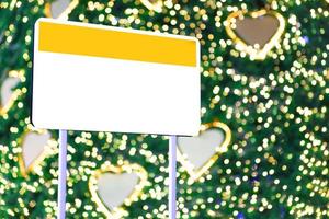 Empty sign and Christmas light blur background photo