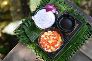 A set of dessert, fruit salad and drink photo