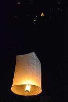 Lantern in night sky photo