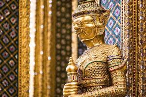 A statue of Yaksa on temple guard at the Temple of the Emerald Buddha, Bangkok, Thailand photo
