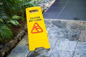 Sign showing warning of caution wet floor photo