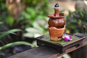 Aromatherapy hot oil in pottery photo