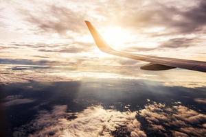 Wing of an airplane flying in the sky photo