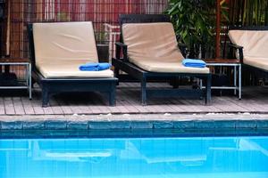 Swimming pool and bed photo