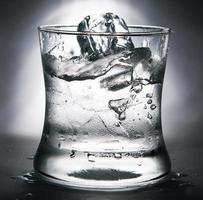 cold water with ice in a glass photo