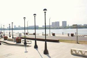 Embankment in river station pier. Starting point of cruise tourism ships. Passenger terminal. Pedestrian park photo