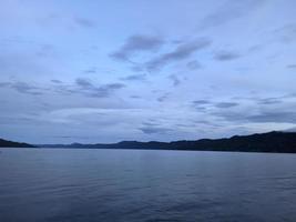 the beauty of the morning sky in lake toba photo