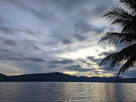 the beauty of the morning sky in lake toba photo