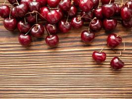 Sweet cherry on a wooden background. Close-up, copy space photo