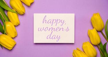 8 march flat lay in yellow and purple colors. Happy woman's day card photo