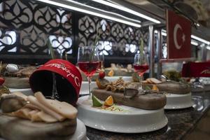 Meals and drinks arranged on table at buffet in restaurant photo