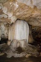 Stalactite and stalagmite in Tham Lod cave photo