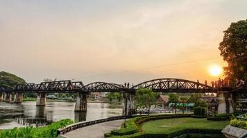 Bridge over the River Kwai at sunset photo