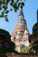 Buddha statue and ancient pagoda photo