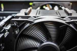 Cooling fan in the computer system unit. photo