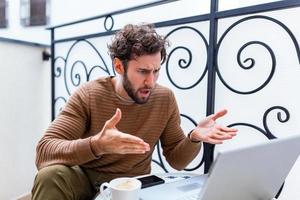 Furious man angry about bad news online or pc software failure, mad helpless office worker having problem with broken laptop, stressed student hates computer crash, user indignant about data loss photo