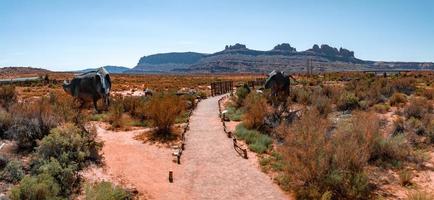 Allosaurus fragilis as well as Tyrannosaurus Rex or T-eEx dinosaurs in the Moab desert photo