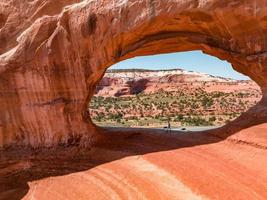 Young man standing in the Arches National Park in Arizona, USA. photo