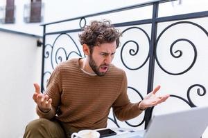 Furious man angry about bad news online or pc software failure, mad helpless office worker having problem with broken laptop, stressed student hates computer crash, user indignant about data loss photo