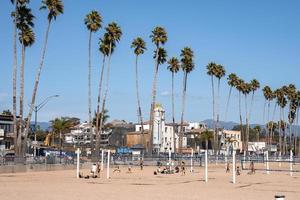 People playing volleyball at Santa Cruz beach during sunny day photo