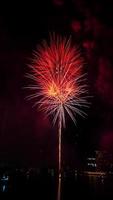 fireworks on the river at night photo