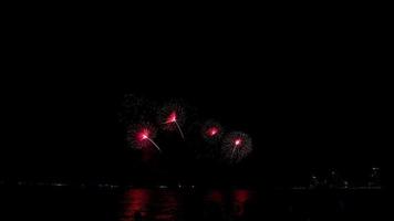 fireworks over the sea at night photo