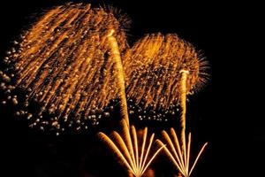 fireworks over the sea at night photo