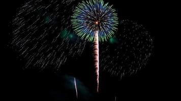 fireworks over the sea at night photo