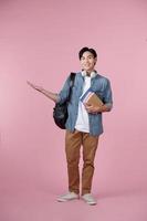 Young student man isolated on pink background extending hands to the side for inviting to come photo