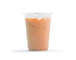 Orange Thai iced condensed milk tea in transparent plastic glass isolated on white background with clipping path photo