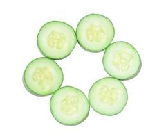 Top view of fresh cucumber slices isolated on white background photo