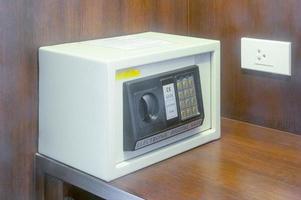 White safe in luxurious hotel room served for keeping precious asset for guests photo