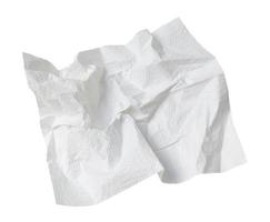 Single screwed or crumpled tissue paper or napkin in strange shape after use in toilet or restroom isolated on white background with clipping path photo