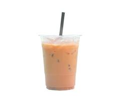 Orange Thai iced condensed milk tea in transparent plastic glass with straw isolated on white background photo