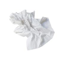 Single screwed or crumpled tissue paper or napkin in strange shape after use in toilet or restroom isolated on white background with clipping path photo