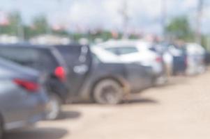 blurred photo of cars are parking in open in front of office, un