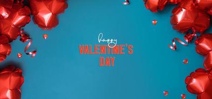 Happy Valentines Day greeting banner with red heart shape baloons on turquoise background photo