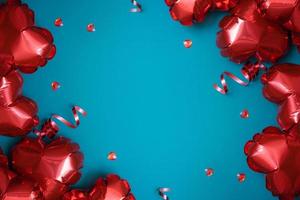 Red heart shape baloons on turquoise background. Valentines Day greeting card. Copy space photo