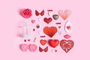 Pattern from different hearts and valentines day symbols elements top view. Creative valentines day flat lay background